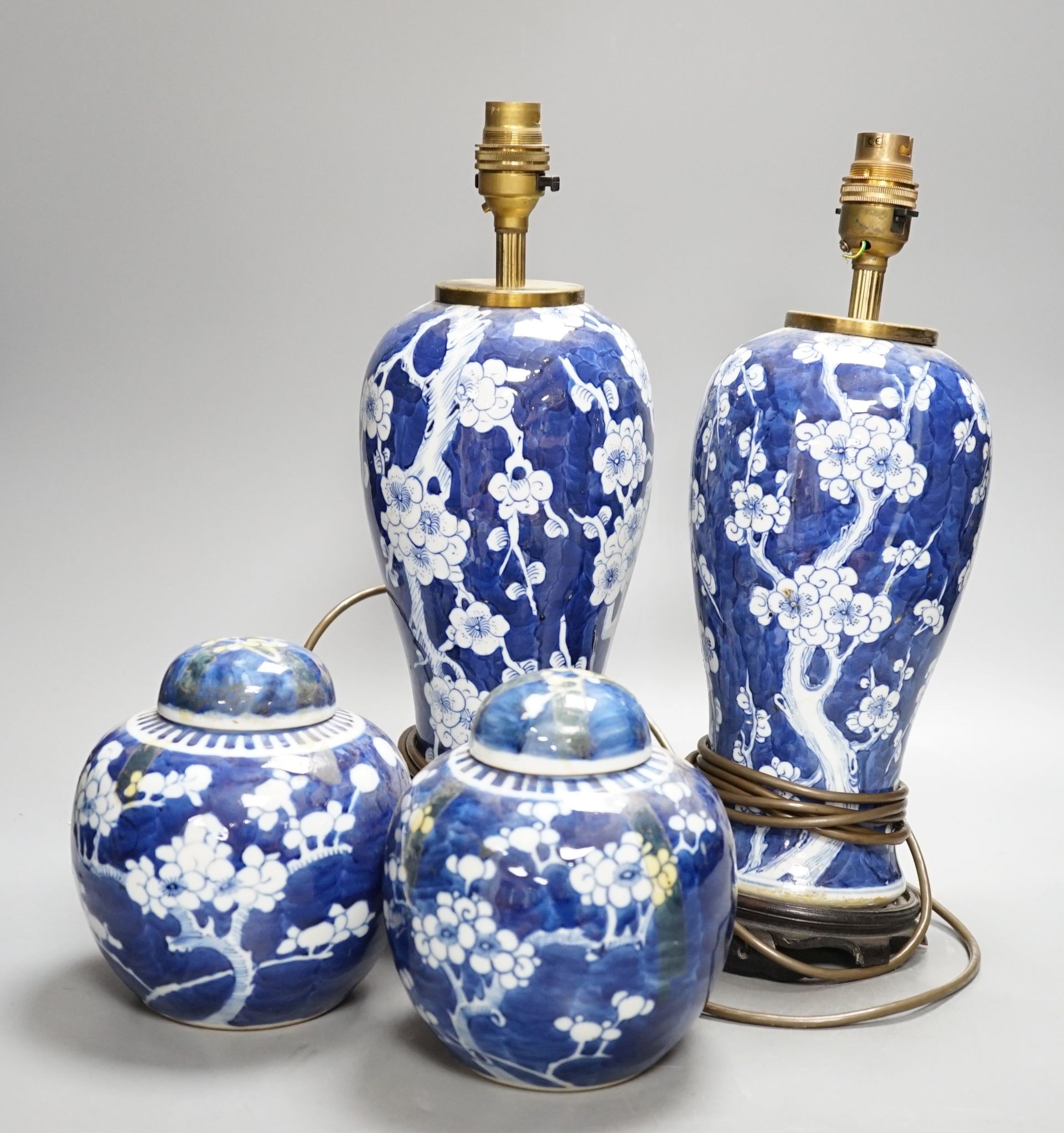 A pair of Chinese blue and white lamps and pair of ginger jars